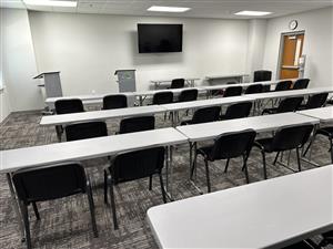 Our Kiwanis meeting room has narrow seminar tables, padded chairs, a podium, and carpeting.  Best for meetings and adult gatherings.
